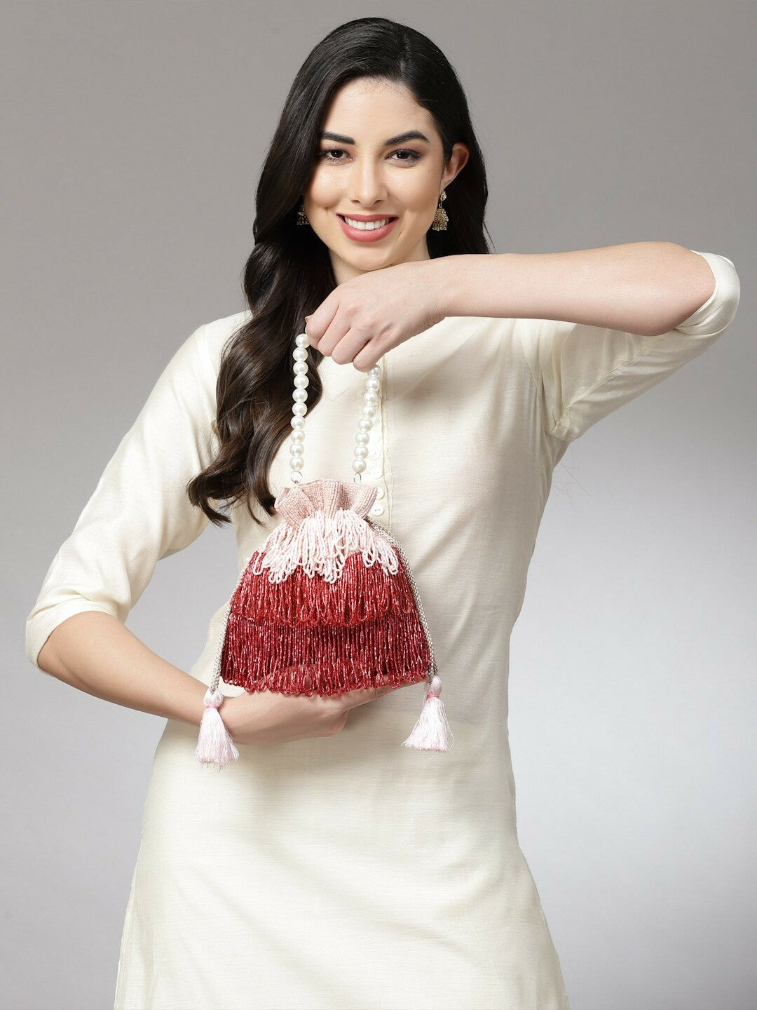 Buy Pink & Red Embellished Tasselled Potli Bags Online – Indiaista